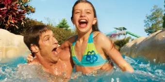 Father and daughter on Roas Rapids at Aquatica Orlando