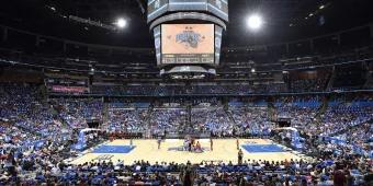 A crowded stadium watching an Orlando Magic basketball game