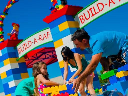 Family building a LEGO raft at LEGOLAND Florida Water Park