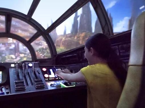 Boy in the Milennium Falcon Cockpit, Star Wars: Galaxy’s Edge in Disneyland Park in California