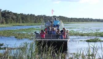 Guests enjoying an airboat ride at Boggy Creek Orlando