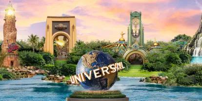 Universal Orlando Resort There is a clear lake with the Universal sign (a large globe spinning with Universal written diagonally over. In the background there is the Velocicoaster drop, iconic lighthouse from the Islands of Adventure entrance, large arch with Universal Studios Florida entrance, portal entrance for Epic Universe and finally the Volcano from Volcano Bay.
