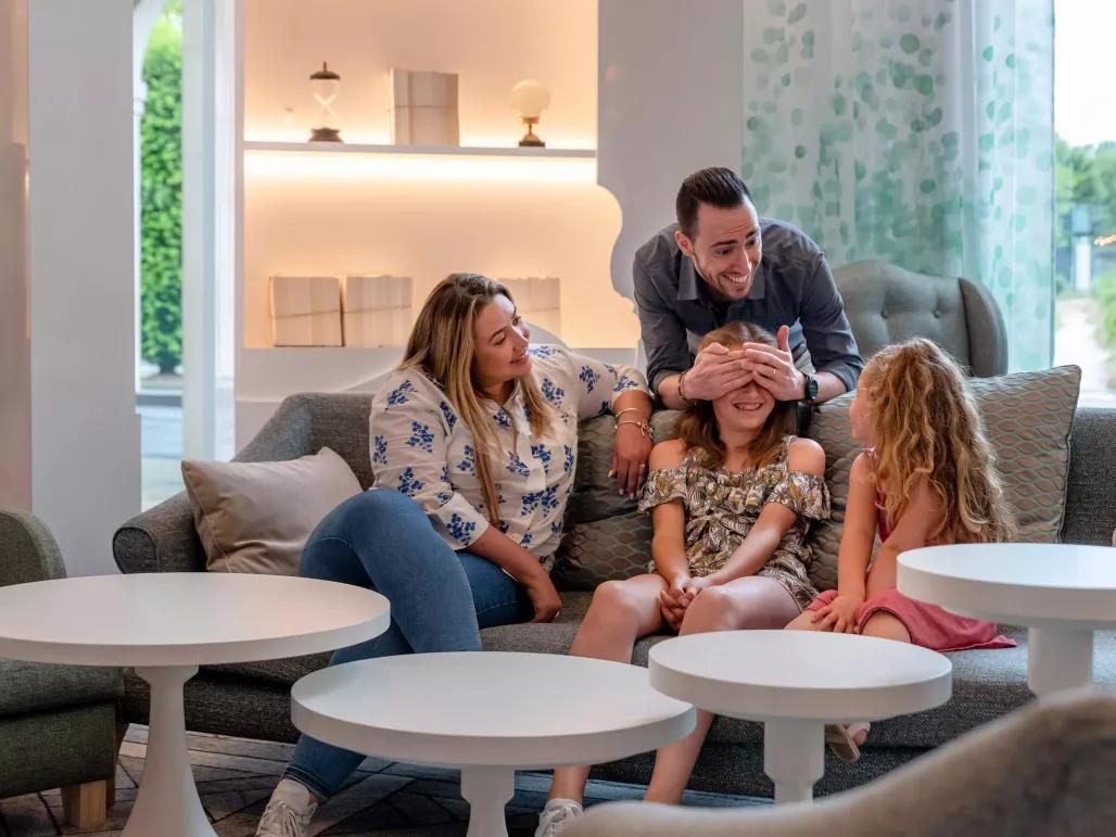 Family sitting in the Dream Castle Hotel Paris Lobby Area