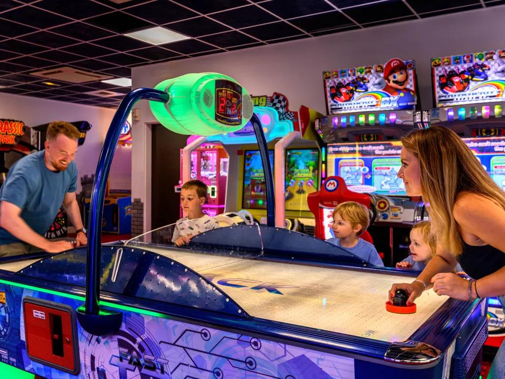 Family in the games room at Explorers Hotel Marne-la-Vallée