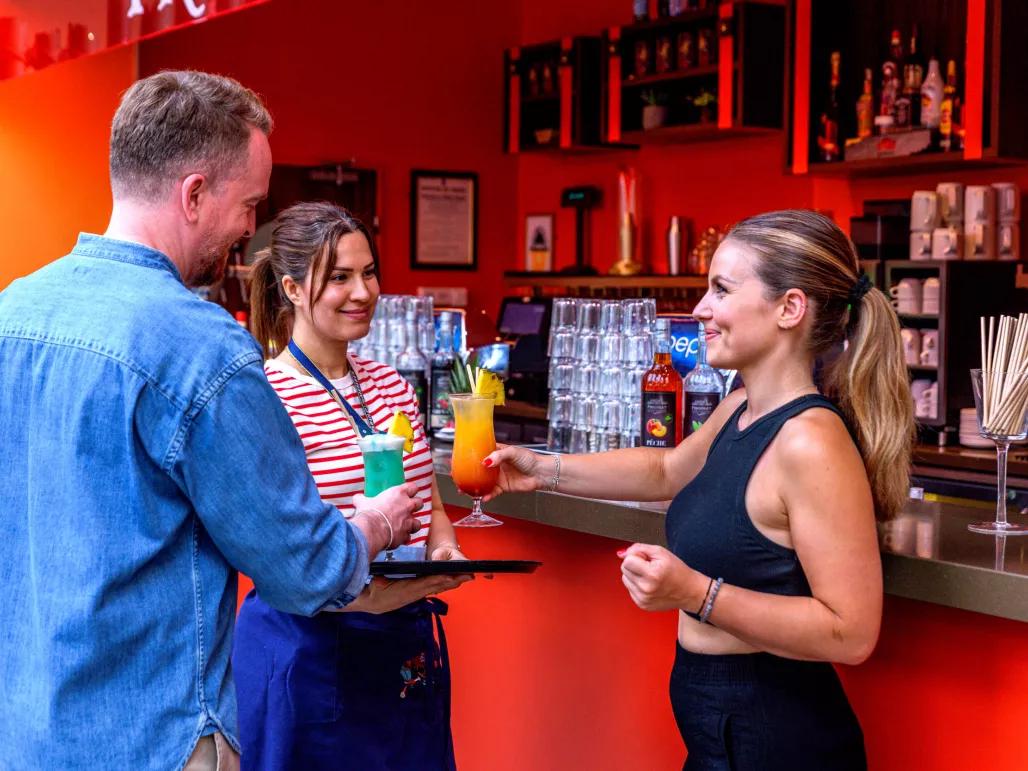Couple drinking cocktails at the Traders Bar, Explorers Hotel Marne-la-Vallée