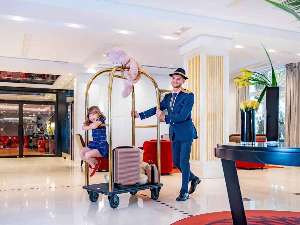 Bellboy and guest at Relais Spa Val d'Europe