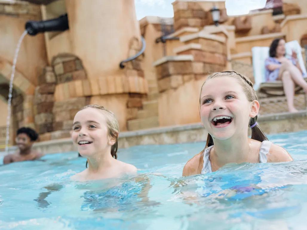Pool at Caribbean Beach resort Walt Disney World Kids in pool at Caribbean Beach Resort