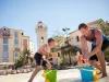 Father and son playing on the beach at Loews Portofino Bay Hotel