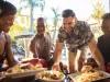 Guests enjoying a burger at the Loews Royal Pacific Resort pool