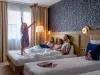 Family in guest Room at the Dream Castle Hotel Paris