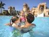 Girls and dad in pool at Disney's Caribbean Beach Resort