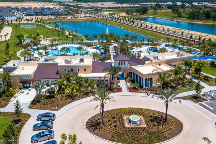Aerial view of the clubhouse, pool complex, and lake at Solara Resort