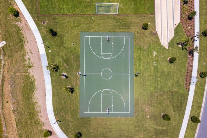 Aerial view of the multi-sport court and soccer field at Solara Resort