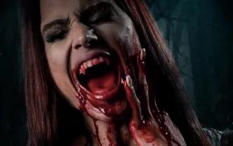A woman screaming and holding her face with blood on her hands and chin