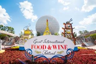 EPCOT International Food and Wine Festival 2023 A sign reading "EPCOT International Food and Wine Festival" in front of Spaceship Earth