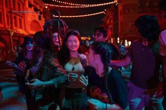 A group of friends being scared at a Halloween event