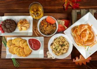 A bird's eye view of a table full of autumnal food dishes