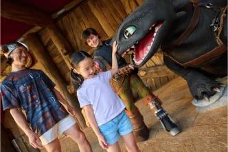 A memorable character encounter with Hiccup and Toothless from How to Train Your Dragon, showcasing a must-do, immersive experience at Universal Orlando Resort.