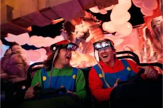 Happy guests enjoying a thrilling, immersive, and high-tech ride experience inside Universal Orlando Resort, showing how modern attractions are designed for diverse guest enjoyment and accessibility.
