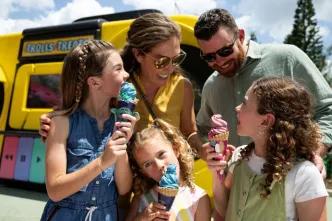 A family enjoying treats at Universal Orlando Resort, illustrating the ease of accessing resort activities and major attractions in Orlando using car-free transport options like shuttles and rideshares.