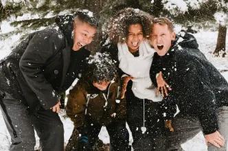 A happy family playing in the snow during a winter holiday