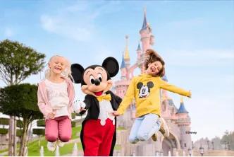 Guests with Mickey Mouse, Disneyland® Park
