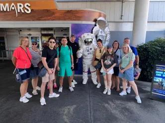 Group taking photo with an astronaut