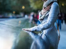 Woman by the Reflecting Pools at the 911 Memorial Museum in New York