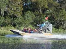 Guests enjoying an airboat ride at Boggy Creek Orlando