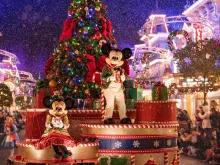 Mickey and Minnie riding on a float at Mickey’s Very Merry Christmas Party at Magic Kingdom Park!