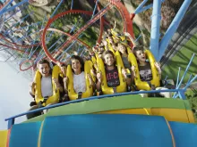 Guests riding Dragon Khan at PortAventura theme park