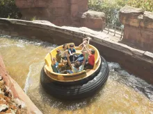 Guests riding Gran Canyon Rapids at PortAventura theme park