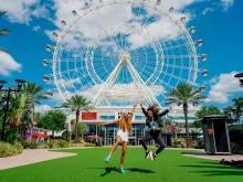 Girls in front of the Icon Orlando Wheel