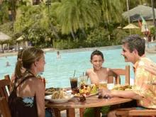 Family eating at Bula Bar & Grille, Loews Royal Pacific Resort