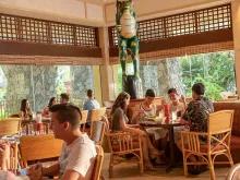 Guests eating at Islands Dining Room, Loews Royal Pacific Resort