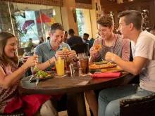 Family eating at Jake's American Bar, Loews Royal Pacific Resort