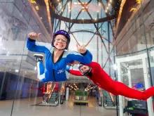 Guest-and-trainer-skydiving-indoors