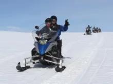 couple-on-snowmobile