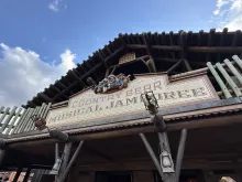 A sign outside of a theme park ride called Country Bear Jamboree