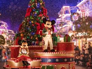 Mickey and Minnie riding on a float at Mickey’s Very Merry Christmas Party at Magic Kingdom Park!
