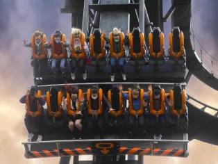 Guests on Oblivion facing downwards in a ride vehicle on the 90 degree drop 