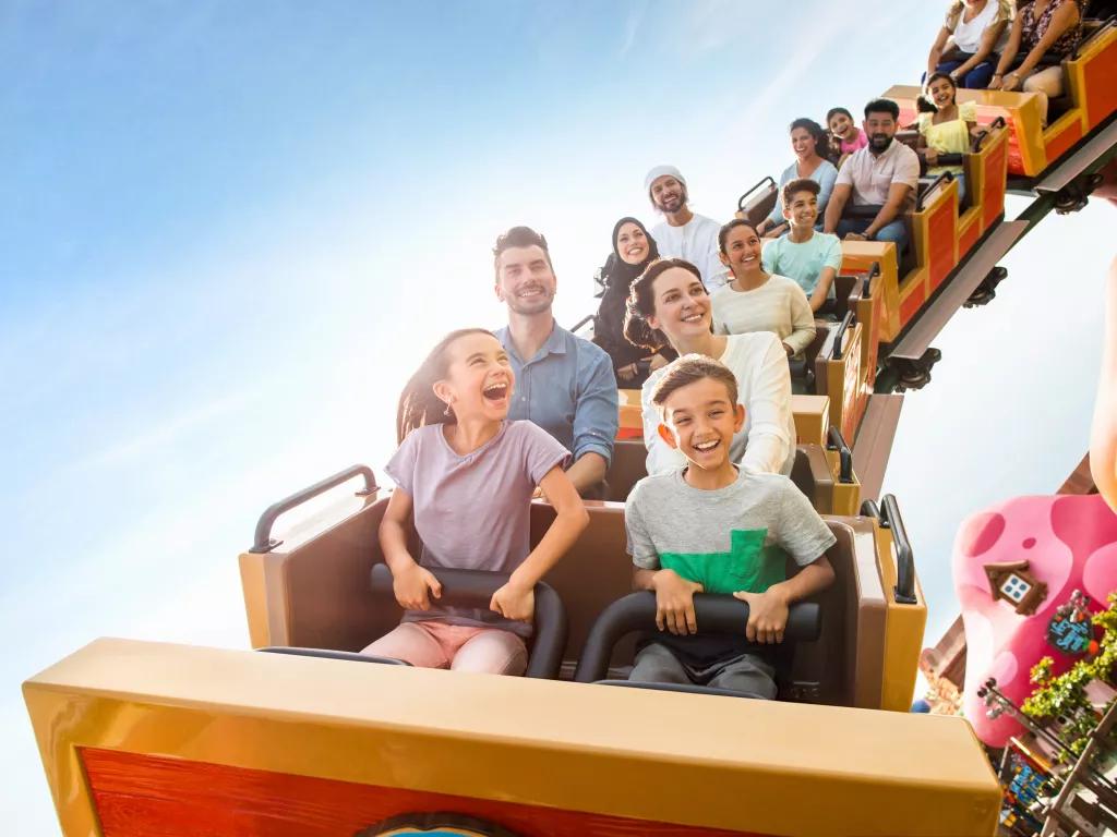 Family riding Smurfs Express at Motiongate Dubai