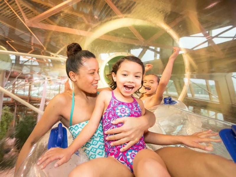 Family on water slide at Les Villages Nature Paris