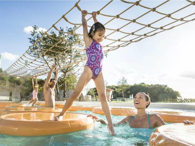Girl playing in outside pool at Les Villages Nature Paris