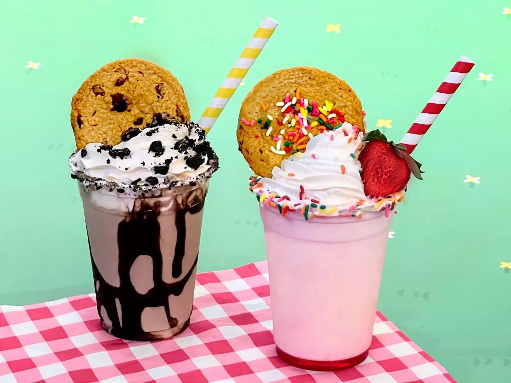 Muddy Puddle Milkshakes A chocolate and a strawberry milkshake, topped with whipped cream and cookies