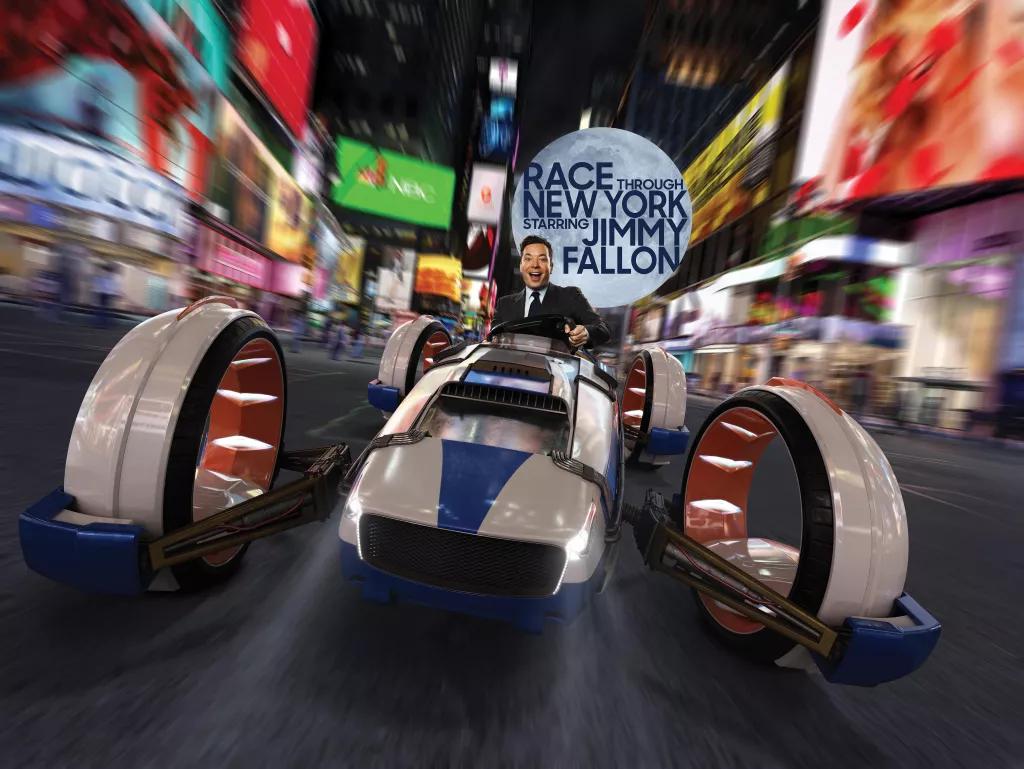 Race Through New York with Jimmy Fallon Promotional image of Jimmy Fallon in a race vehicle going through New York