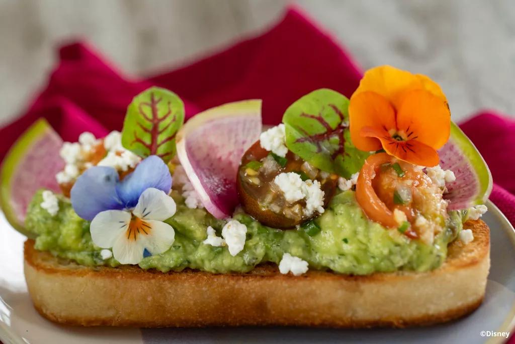 Avocado Toast from Sunshine Griddle Ciabatta topped with avocado, tomatoes and flowers
