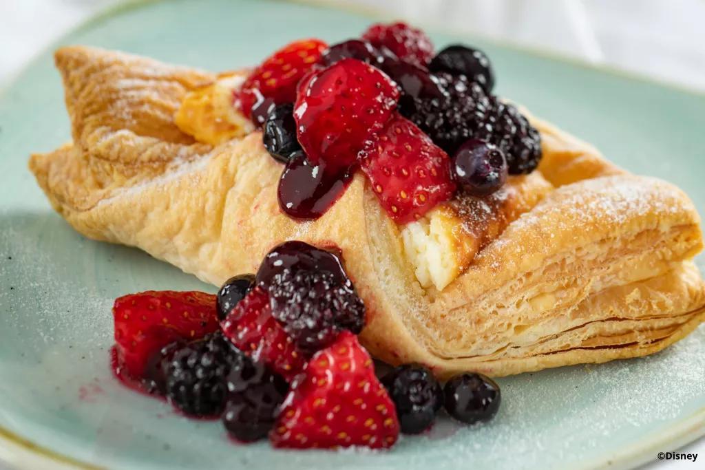 Warm cheese strudel at Bauernmarkt Strudel pastry filled with cream cheese and topped with mixed berries