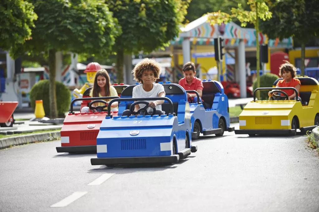 LEGOLAND Driving School Children driving cars that look like lego cars at Legoland