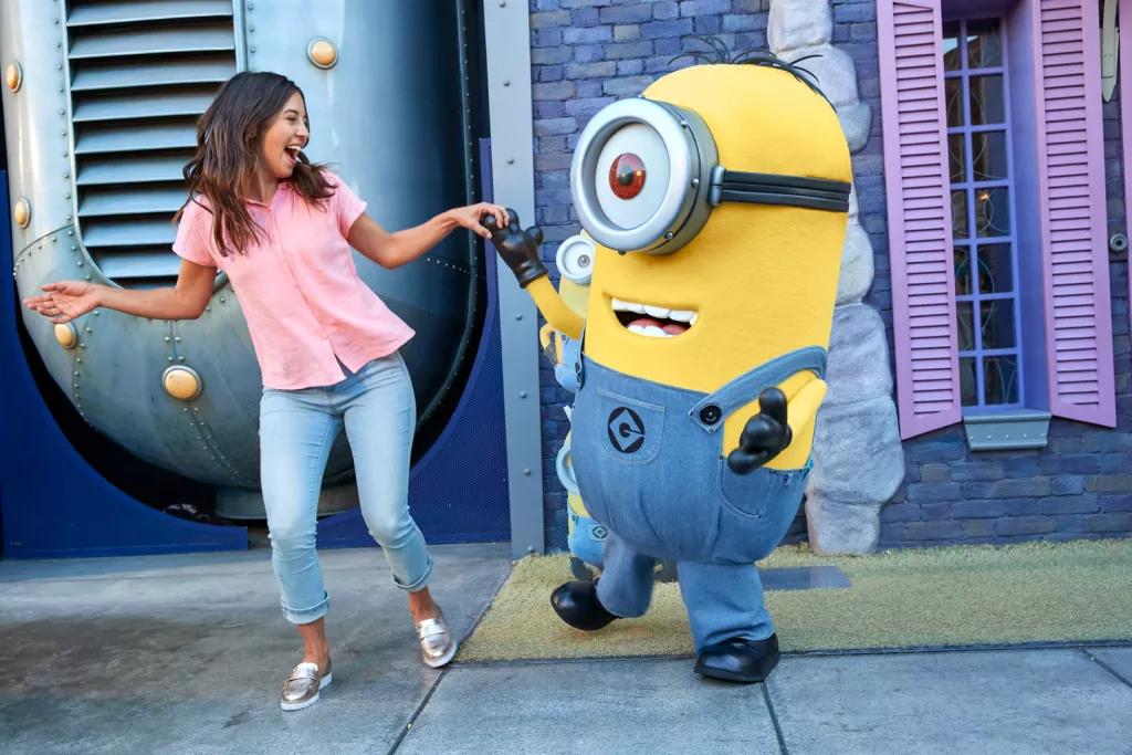 Despicable Me at Universal Orlando Resort A woman dancing with a minion at Universal Orlando